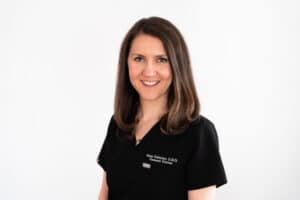 Professional portrait of a smiling female dentist